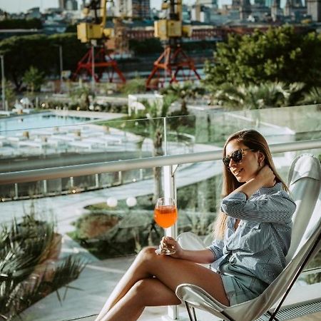 Sls Buenos Aires Puerto Madero Hotel Kültér fotó A woman drinking an Aperol Spritz