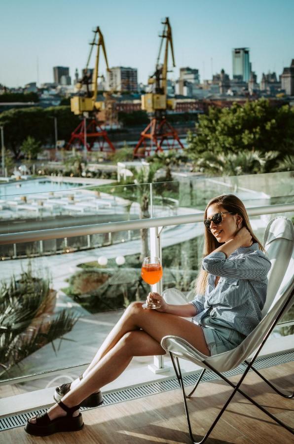 Sls Buenos Aires Puerto Madero Hotel Kültér fotó A woman drinking an Aperol Spritz